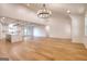Bright and airy living room with hardwood floors and an open concept design leading to the kitchen and dining area at 1947 Clark Dr, Tucker, GA 30084