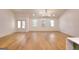 Hardwood floors, recessed lighting, large windows, and an open floor plan in this bright and spacious living room at 1947 Clark Dr, Tucker, GA 30084