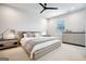 Relaxing bedroom featuring a platform bed, neutral colors, and a modern ceiling fan at 247 Widener Way, Peachtree City, GA 30269