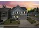 Charming two-story home with an inviting front yard and driveway leading to an attached two-car garage at 247 Widener Way, Peachtree City, GA 30269
