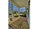 Charming front porch with brick flooring, decorative pillars, and a view of the neighborhood at 247 Widener Way, Peachtree City, GA 30269