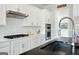 Modern kitchen with white cabinets, stainless steel appliances, subway tile backsplash, and chrome fixtures at 247 Widener Way, Peachtree City, GA 30269