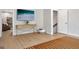 Bright living room featuring hardwood floors, console table with drawers, and doorway at 247 Widener Way, Peachtree City, GA 30269