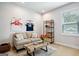 Bright living room with a comfortable couch, coffee table, and decorative accents at 247 Widener Way, Peachtree City, GA 30269