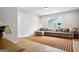 Comfortable living room featuring a large sofa, area rug, hardwood floors, and recessed lighting at 247 Widener Way, Peachtree City, GA 30269