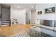 Living room featuring modern sofa, hardwood floors, decor, and stairway at 247 Widener Way, Peachtree City, GA 30269
