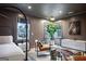 Spacious primary bedroom boasting bright windows and a comfortable sitting area with modern decor at 247 Widener Way, Peachtree City, GA 30269