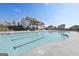 Community pool and clubhouse with ample seating, perfect for relaxation and social gatherings at 247 Widener Way, Peachtree City, GA 30269