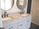 Double sink vanity with granite counters and modern faucets, enhancing the bathroom's elegance and functionality at 4383 Chestnut Lake Ave, Lithonia, GA 30038