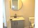 Bathroom with granite countertop on vanity and a toilet, offering modern functionality and style at 4383 Chestnut Lake Ave, Lithonia, GA 30038