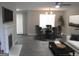 Cozy dining area featuring a fireplace, modern light fixture, and table with seating for six at 4383 Chestnut Lake Ave, Lithonia, GA 30038