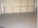 Spacious two-car garage with epoxy flooring and plenty of room for storage at 4383 Chestnut Lake Ave, Lithonia, GA 30038