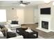 Inviting living room with modern fireplace, television, and neutral-toned furnishings at 4383 Chestnut Lake Ave, Lithonia, GA 30038