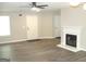 Spacious living room featuring modern floors, a fireplace, and lots of natural light at 4383 Chestnut Lake Ave, Lithonia, GA 30038