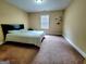 Bedroom with carpet, ceiling fan, window and plenty of open floor space at 180 Oakland Hills Way, Lawrenceville, GA 30044
