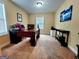Home office with a large desk, neutral walls, carpet and window that provides natural light at 180 Oakland Hills Way, Lawrenceville, GA 30044