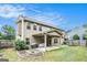 Large backyard with a covered patio, grill, and a basketball hoop at 230 Haleys Ct, Woodstock, GA 30188