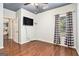 Minimalist bedroom featuring hardwood floors, modern decor, and a large window at 230 Haleys Ct, Woodstock, GA 30188
