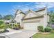 Home featuring a two-car garage with an extended driveway and manicured landscaping at 230 Haleys Ct, Woodstock, GA 30188