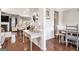 Inviting hallway with hardwood floors, decorative mirror, and a view into the open living spaces at 230 Haleys Ct, Woodstock, GA 30188