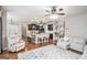 Open-concept kitchen and living area with hardwood floors, granite countertops, and stylish furnishings at 230 Haleys Ct, Woodstock, GA 30188