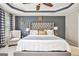 Inviting main bedroom featuring a plush bed, elegant decor, and soft carpeting at 230 Haleys Ct, Woodstock, GA 30188