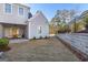 Spacious backyard with stone retaining wall and privacy fence at 915 Laurel Brooke Ave, Peachtree City, GA 30269