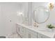 Modern bathroom features double vanity with marble countertop and elegant gold hardware at 915 Laurel Brooke Ave, Peachtree City, GA 30269