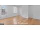 Bright bedroom features hardwood floors, crisp white trim, and a sunny window at 915 Laurel Brooke Ave, Peachtree City, GA 30269