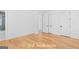Bright third bedroom boasts hardwood floors and white trim at 915 Laurel Brooke Ave, Peachtree City, GA 30269