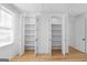 Walk in closet with wood floors and white walls at 915 Laurel Brooke Ave, Peachtree City, GA 30269
