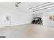 Spacious three-car garage with overhead doors and a golf cart at 915 Laurel Brooke Ave, Peachtree City, GA 30269