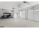 Spacious three-car garage with overhead doors and room for storage at 915 Laurel Brooke Ave, Peachtree City, GA 30269