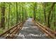 Scenic golf cart path winding through lush greenery offering a peaceful and recreational route at 915 Laurel Brooke Ave, Peachtree City, GA 30269