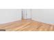 Hallway featuring hardwood floors and white trim at 915 Laurel Brooke Ave, Peachtree City, GA 30269