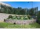 Landscaped garden area with cast iron fence and irrigation at 915 Laurel Brooke Ave, Peachtree City, GA 30269