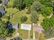 Aerial shot of a home with a green lawn and surrounding trees in a residential neighborhood at 3548 Meadowview Ct, Rex, GA 30273