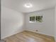 Neutral bedroom with bright window and wood flooring at 3548 Meadowview Ct, Rex, GA 30273