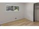 Neutral bedroom featuring sleek flooring and a bright window at 3548 Meadowview Ct, Rex, GA 30273