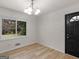 Bright dining room featuring neutral walls, new flooring, and updated lighting at 3548 Meadowview Ct, Rex, GA 30273