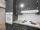 Kitchen showcasing black cabinets, white appliances, granite counters, and subway tile at 3548 Meadowview Ct, Rex, GA 30273