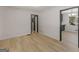 Living room featuring new floors and fresh paint, leading to other rooms at 3548 Meadowview Ct, Rex, GA 30273