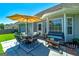 Well manicured backyard with patio table and umbrella at 127 Laurel Springs Dr, Mcdonough, GA 30253