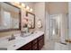 Bathroom featuring dual sinks, tile flooring, and updated fixtures at 127 Laurel Springs Dr, Mcdonough, GA 30253