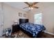 Well-lit bedroom with a ceiling fan, a window, and hardwood floors at 127 Laurel Springs Dr, Mcdonough, GA 30253