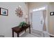 Inviting foyer with decorative table and front door at 127 Laurel Springs Dr, Mcdonough, GA 30253