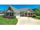 Beautiful brick home with attached garage, pristine lawn, and well-maintained landscaping at 127 Laurel Springs Dr, Mcdonough, GA 30253