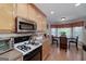 Sunlit kitchen featuring stainless appliances, breakfast area, and updated countertops at 127 Laurel Springs Dr, Mcdonough, GA 30253