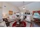Bright living room with fireplace, sofa, and comfortable seating arrangement at 127 Laurel Springs Dr, Mcdonough, GA 30253