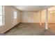 Finished basement offering ample space for recreation, featuring neutral walls and carpeted floors at 1851 Grove Way, Hampton, GA 30228
